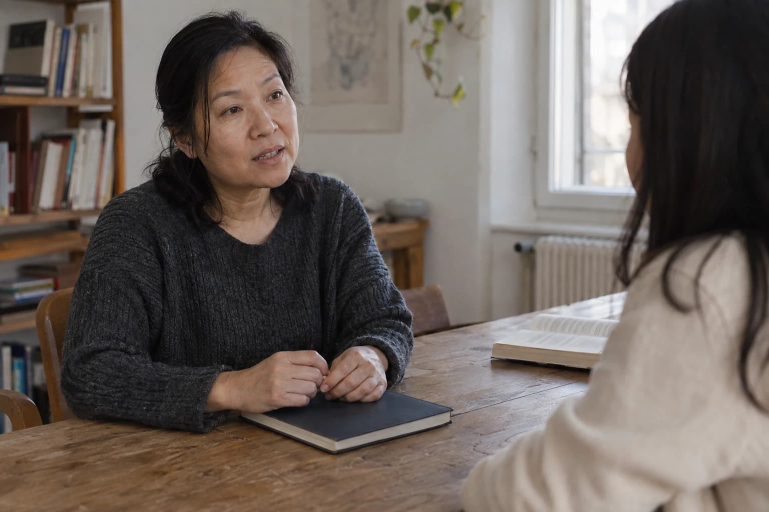 A mentor and adult learner in a focused discussion